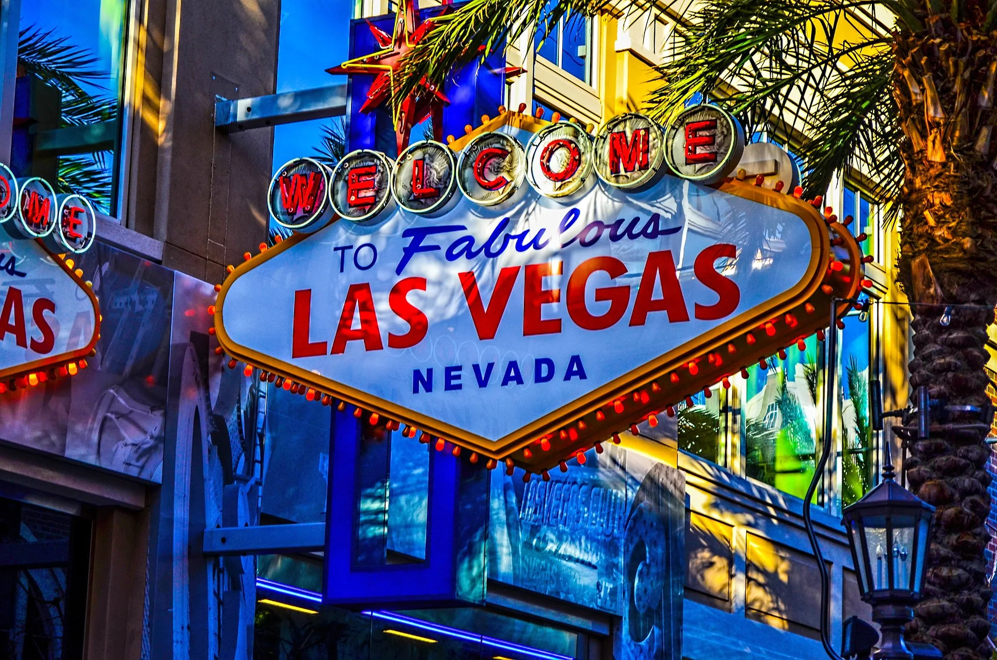 The Welcome to Fabulous Las Vegas sign, lit at dusk.